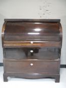 A mahogany barrel fronted bureau CONDITION REPORT: 115cm high by 104cm wide by 60cm
