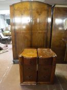 A walnut double door wardrobe together with a pair of three drawer bedside chests
