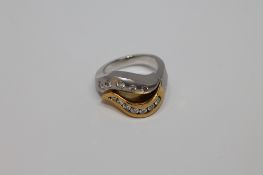 An 18ct gold yellow and white gold ring set with 12 diamonds, 14.
