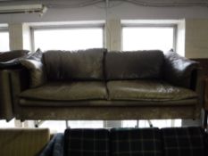A late twentieth century leather three seater settee,