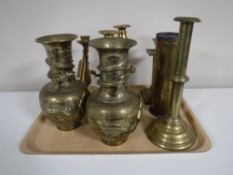 A tray containing five brass candlesticks,