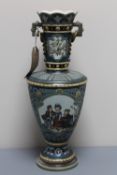 A Mettlach vase decorated with panels of children dancing, lattice decoration on blue ground,