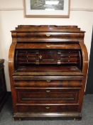 A continental mahogany roll top desk,