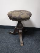 An upholstered Victorian mahogany pedestal stool