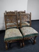 Four carved Victorian mahogany dining chairs