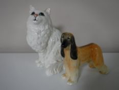 A Beswick figure of an Afghan hound, together with a Beswick figure of a cat,