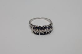 An 18ct white gold sapphire and diamond ring