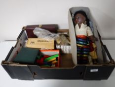Assorted board games together with a box containing mid 20th century doll,