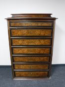 A late nineteenth century continental walnut seven drawer chest