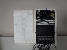 A ZX 81 Sinclair computer with leads