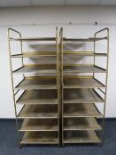 Two sets of gilt metal eight tier shelves