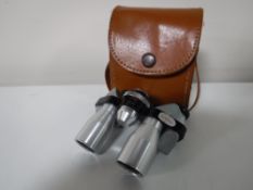 A set of cased Ginza 10x20 miniature binoculars