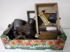 A box of balance scales, cobblers last, hand saw, shoe cleaning brushes,
