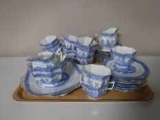 Forty two pieces of blue and white gilt-rimmed Willow pattern hexagonal-shaped tea china (two