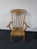 A pine kitchen armchair