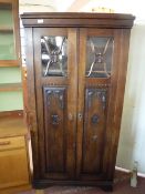 An early twentieth century oak double door cabinet
