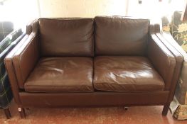 A late twentieth century Danish brown leather two seater settee CONDITION REPORT: