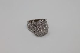 An 18ct gold diamond cluster ring, approximately 1.7 carat, 7.
