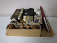 A tray of tins, sewing items,