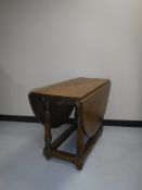 An early 20th century drop leaf table