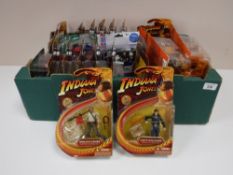 A boxed containing boxed Indiana Jones And The Crystal Skull action figures,