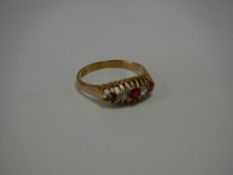 An 18ct gold diamond and ruby ring