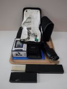 A tray of Garman sat nav, 10 x 46 spotting scope, digital camera, slide rule,
