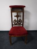 A carved oak church chair