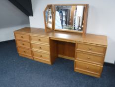 A teak G plan seven drawer chest,
