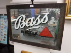 An oak framed Bass in Bottle advertisement mirror