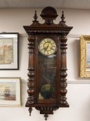 A late 19th century mahogany cased Vienna wall clock