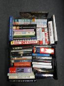 Two crates containing hard back books, novels, autobiographies,