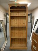 A tall pine bookcase,