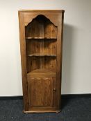 A pine corner cupboard