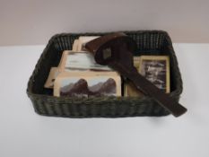 A basket containing a Stereoscope viewer,