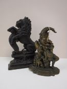 Two cast iron door stops;