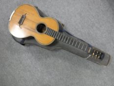 A mid twentieth century acoustic guitar in carry case CONDITION REPORT: No visible