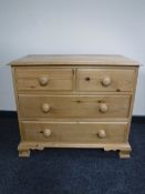 A pine four drawer chest