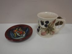 A Moorcroft Blackberry pattern mug,