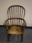 An antique elm Windsor armchair