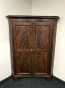 A Victorian inlaid mahogany double door corner cabinet