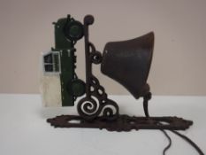 A cast iron bell with bracket,