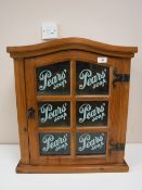 A pine glazed door wall cabinet - Pears Soap CONDITION REPORT: This measures 59cm