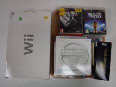 A boxed Nintendo Wii, together with a tray of assorted Nintendo Wii games, accessories,