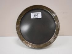 A circular sterling silver photo frame