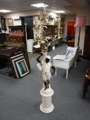 A china Blackamoor style figural four way floor lamp,