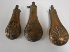 Three brass shot flasks