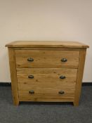 A good quality light oak three drawer chest,