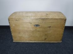An antique pine domed trunk