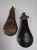 A copper shot flask and a leather shot flask (2)